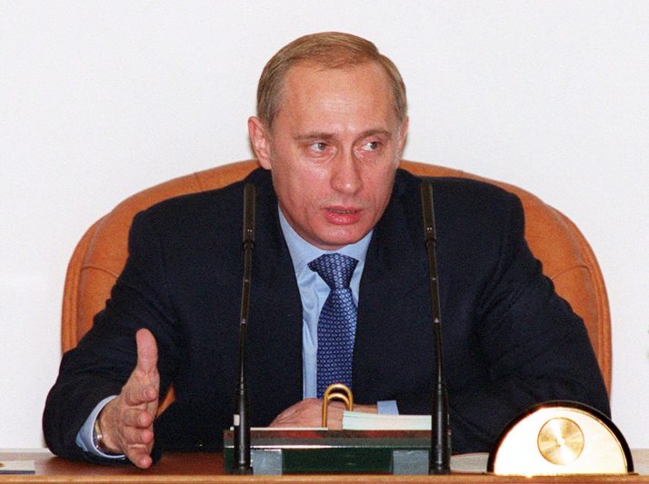 Russian Prime Minister Vladimir Putin gestures as